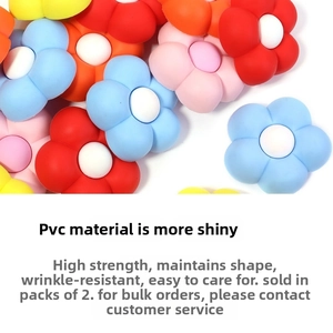 Macro detail of colorful 3D PVC flower charms for beach bags and tote accessories