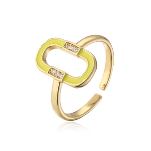Macro shot of 18K gold plated ring featuring neon yellow enamel and zircon detail