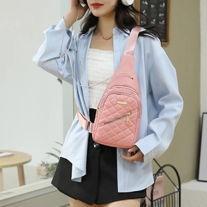 Pink quilted nylon chest bag with golden zippers and adjustable strap for women
