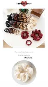 Detailed view of faux leather scrunchies in various colors and three different sizes