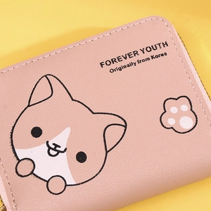 Close-up of pink PU leather wallet featuring cute cartoon cat patterns and textures
