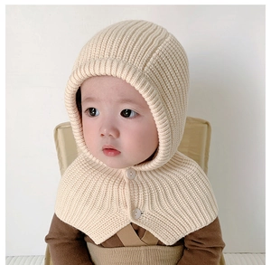 Detail of baby knitted hooded scarf with double-breasted buttons in cream rib-knit fabric
