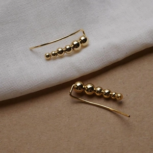 Detailed view of gold plated S925 sterling silver minimalist gradient bead ear crawlers