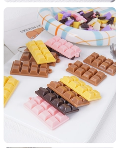 Close-up of resin chocolate charms in various colors for DIY keychains and pendants
