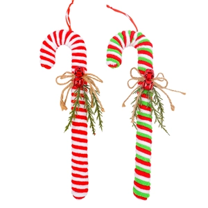 Candy cane Christmas ornaments with red white plush texture and mini bells on white background