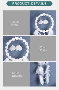 Detailed close-up of dreamcatcher components showing rattan circle, pom poms and feathers
