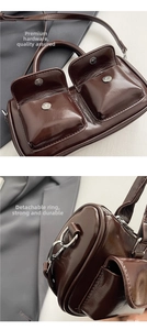 Detail of silver buckles and detachable ring on a dark brown glossy saddle bag