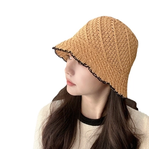Women's khaki straw bucket hat with black scalloped edge and hollow out knit design