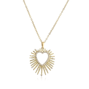 Detailed close-up of golden spiked heart necklace with sparkling clear zircon inlay