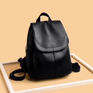 Elegant black faux leather women's anti-theft backpack with pebble texture and flap