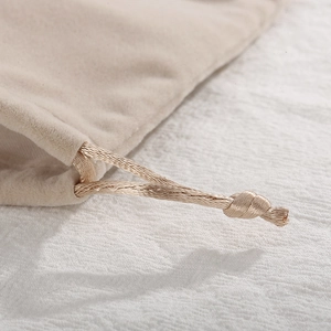 Elegant beige velvet drawstring jewelry pouch with high-quality woven braided cord
