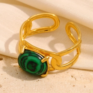 Detail of 18K gold plated stainless steel ring with oval green malachite stone inlay