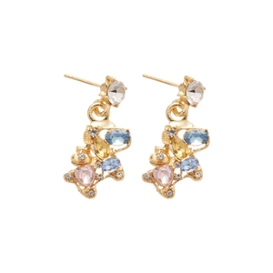 Golden bear earrings with colorful crystals and pink heart stone on white background