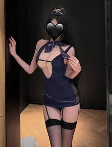 Detail of sexy flight attendant uniform with deep blue mini dress and garter stockings