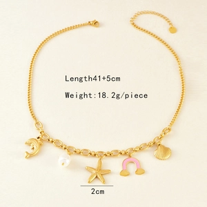 Detailed view of ocean-themed necklace with gold dolphin, starfish, and pearl charms