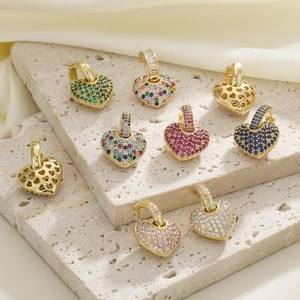 Elegant gold plated heart earrings featuring colorful pavé zircon in various vibrant shades