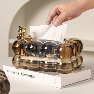 Macro detail of luxury brown tissue box with gold bear ornament and bubble texture