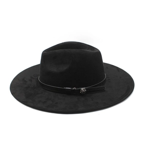 Detailed view of black wide brim suede hat with leather band and silver floral metal accent