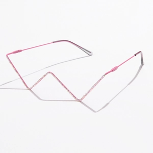 Detail of pink metal frame with glittering rhinestones in a modern W-shaped design