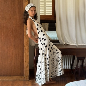 Side view of sexy backless polka dot halter dress with matching headscarf in retro style