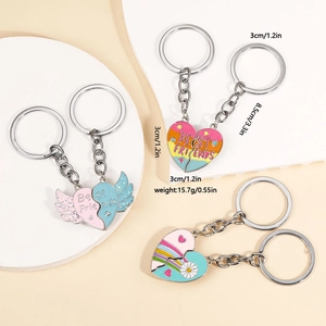 Close-up of rainbow heart magnetic best friends keychains with enamel butterfly detail