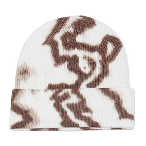 Close-up of tie-dye knit beanie showing detailed thick vertical rib texture in white and brown