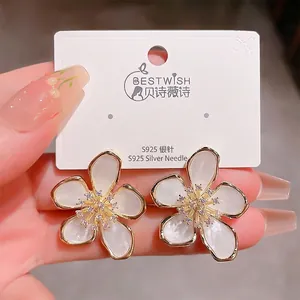 Elegant five-petal flower stud earrings with S925 silver needle and central crystals