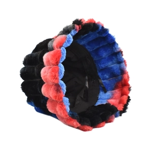Close-up of plush tie-dye bucket hat showing red, blue, and black faux fur texture