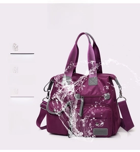 Waterproof nylon travel bag featuring splash-resistant fabric and multi-pocket design