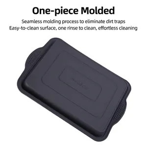 Dark gray silicone brownie baking pan with non-slip side handles and heat-resistant base