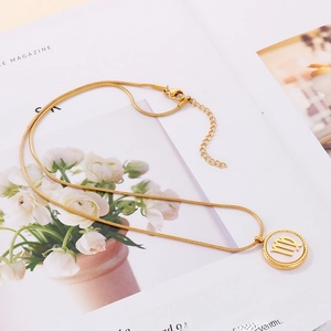 Gold stainless steel Virgo zodiac necklace with shell pendant on a stylish snake chain