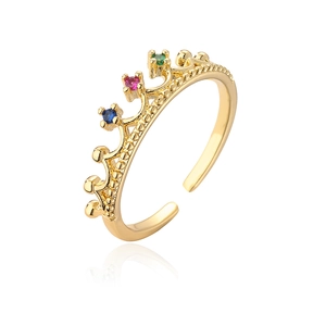 Close-up of gold flower crown ring with colorful zircon stones on white background