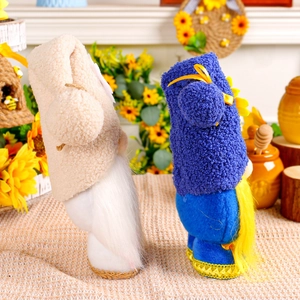 Sunflower bee gnomes plush dolls with knit caps and floral accents in a spring setting