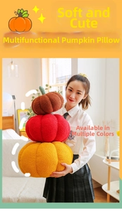 Close-up of stacked colorful pumpkin throw pillows in soft textured boucle fabric
