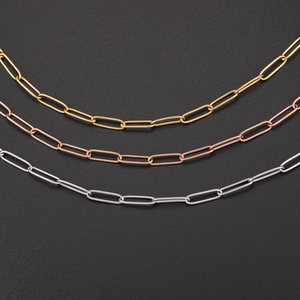 Macro detail of oval link chains in gold, rose gold, and silver finishes for DIY jewelry
