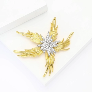 Macro detail of fire starfish brooch with gold silver plating and sparkling rhinestones