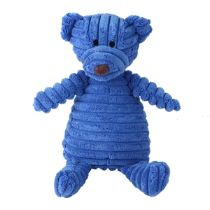 Detail of blue corduroy squeaky dog toy showing textured fabric and teddy bear features