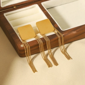 French vintage gold square stud earrings with delicate tassel chains in a wooden box