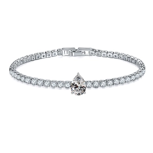 Macro detail of silver tennis bracelet with pear-shaped main stone and cubic zirconia inlay