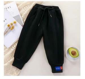 Casual black fleece-lined kids sweatpants with ribbed cuffs and drawstring waist