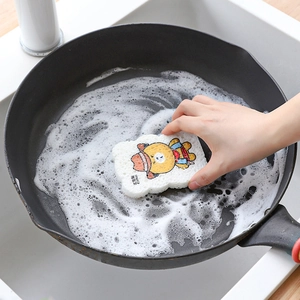 Cartoon Brown Bear wood pulp sponge cleaning a black iron pan with dense white foam