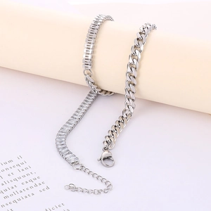 Detail of silver Cuban chain necklace with rectangular cubic zirconia inlay and lobster clasp
