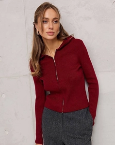 Detail of slim-fit dark red ribbed knit zip-up hoodie featuring a sleek metal zipper