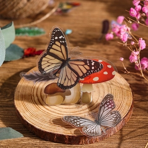 Vintage mushroom and butterfly clear PVC stickers on wood with dried flowers