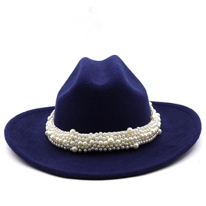Detail of navy wool felt fedora featuring luxury pearl encrusted decorative band