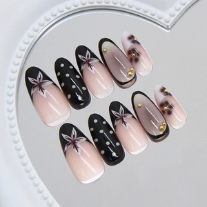 French retro floral and polka dot press-on nails with gold beads and nude pink finish