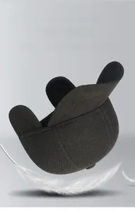 Close-up of winter baseball cap with ear flaps featuring 3D cut and feather accent