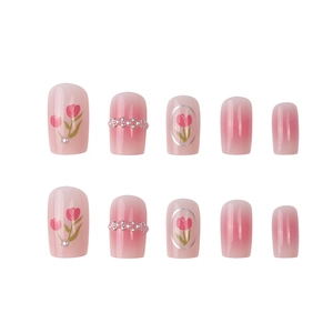 Pink gradient press-on nails with red tulip art and pearl accents in short round shape