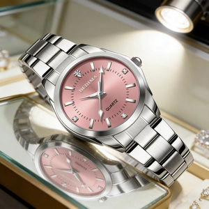 Macro shot of silver quartz watch with pink dial and diamond markers in a jewelry box