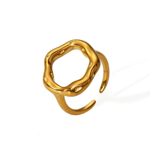 Irregular gold plated stainless steel wave ring featuring a minimalist molten metal texture